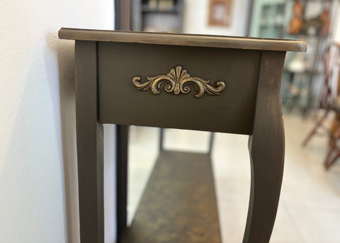 Refurbished vintage console table with a distressed wood finish and ornate carvings, perfect for adding character to entryways or living rooms. This stylish table combines classic design with modern functionality, making it ideal for displaying decor or as a chic storage solution.