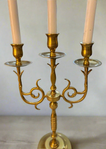 Elegant golden candle holder crafted from high-quality brass, featuring a sleek, modern design with intricate detailing. Perfect for adding a touch of sophistication to any room, this candle holder enhances the ambiance of dining tables, mantels, or home decor displays.