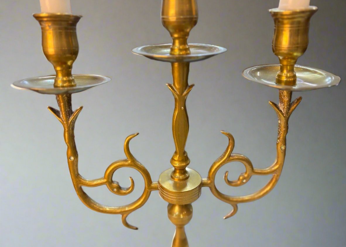 Elegant golden candle holder crafted from high-quality brass, featuring a sleek, modern design with intricate detailing. Perfect for adding a touch of sophistication to any room, this candle holder enhances the ambiance of dining tables, mantels, or home decor displays.