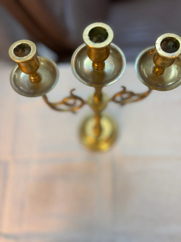 Elegant golden candle holder crafted from high-quality brass, featuring a sleek, modern design with intricate detailing. Perfect for adding a touch of sophistication to any room, this candle holder enhances the ambiance of dining tables, mantels, or home decor displays.